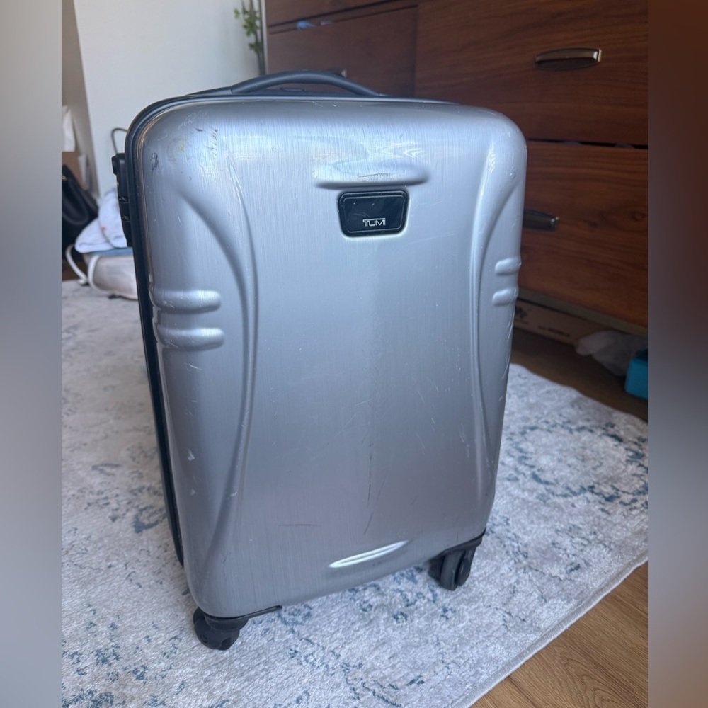 Silver small international carry on suitcase